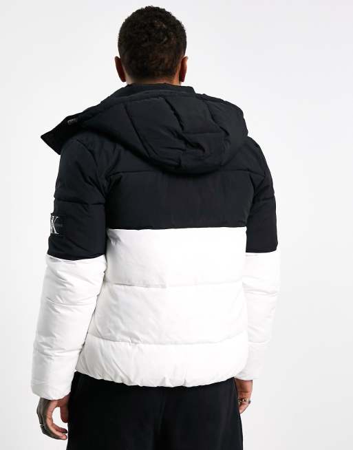 stormloop Crimineel Plagen Calvin Klein Jeans color block hooded puffer jacket in black/white | ASOS