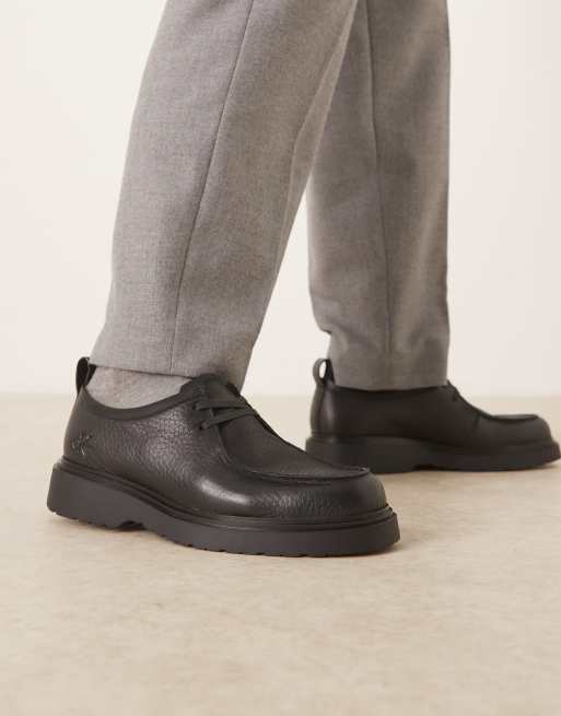 Calvin Klein Jeans – Combat – Lederschuhe zum Schnüren in Schwarz