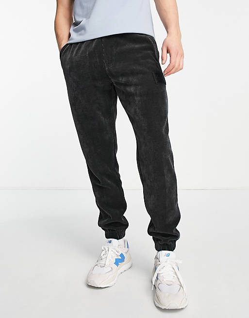 Calvin Klein Jeans corduroy joggers in black | ASOS
