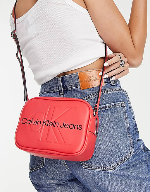 Calvin Klein Jeans cotton monogram logo sculpted camera bag in red - RED |  ASOS