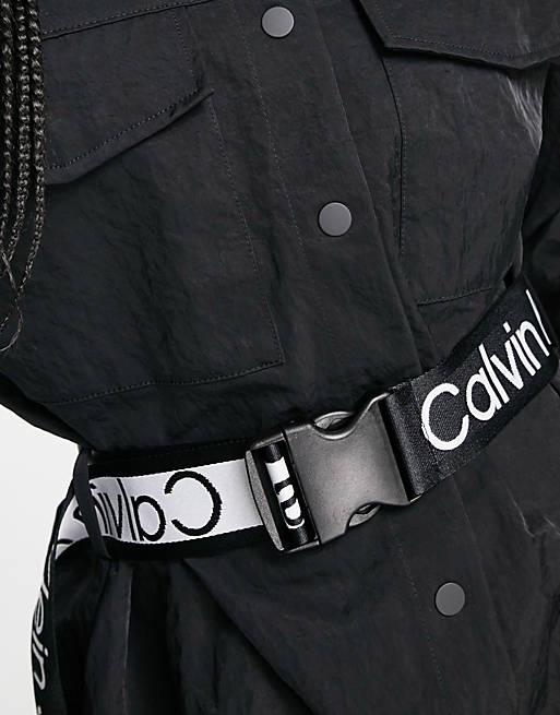 Calvin Klein Jeans crinkle nylon belted dress in black | ASOS