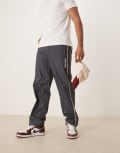 [Calvin Klein Jeans] Calvin Klein Jeans crinkle nylon track pants in navy W32 Ebony