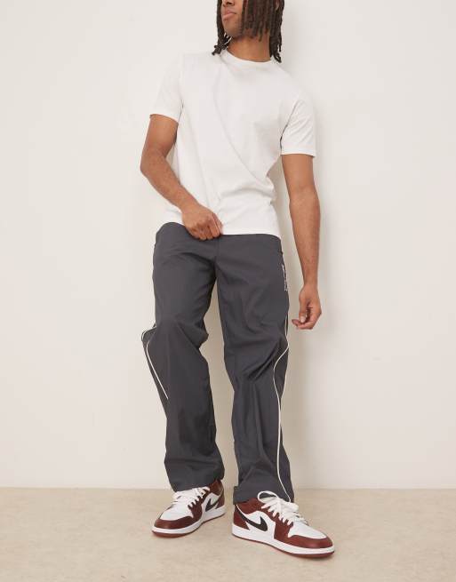 Calvin Klein Jeans crinkle nylon track pants in navy ASOS