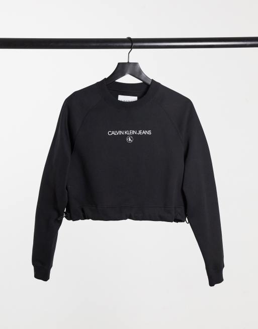 Calvin Klein Jeans cropped crew neck sweater in black | ASOS