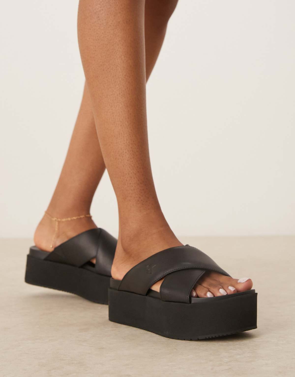 Calvin Klein Jeans cross strap flatform sandals in black