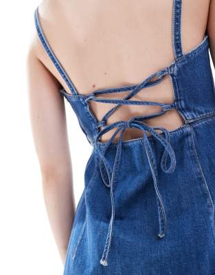Calvin Klein Jeans cut out denim mini dress in mid wash | ASOS