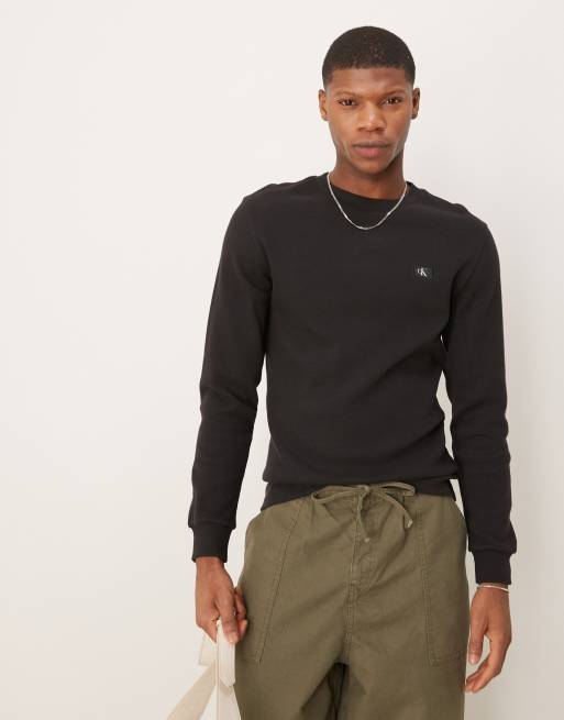 Calvin Klein Jeans – Czarny top z tkaniny o waflowej fakturze z długim rękawem i naszywką