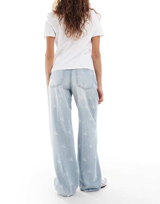 Calvin Klein Jeans distressed logo print wide leg jeans in light wash