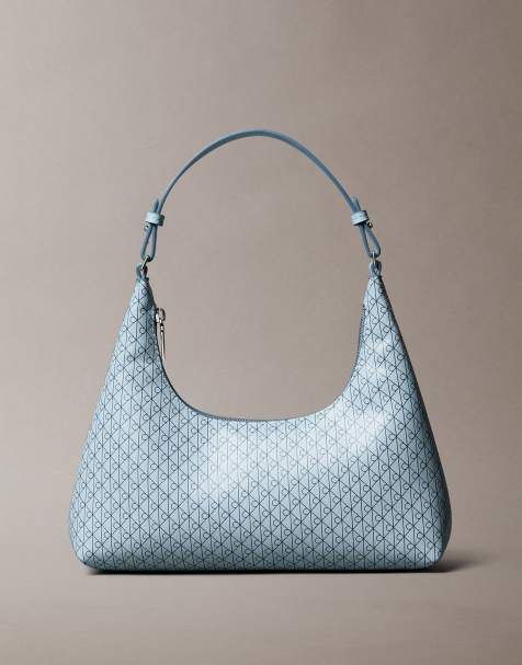 Calvin Klein Jeans emblem monogram logo shoulder bag in light blue - view 1