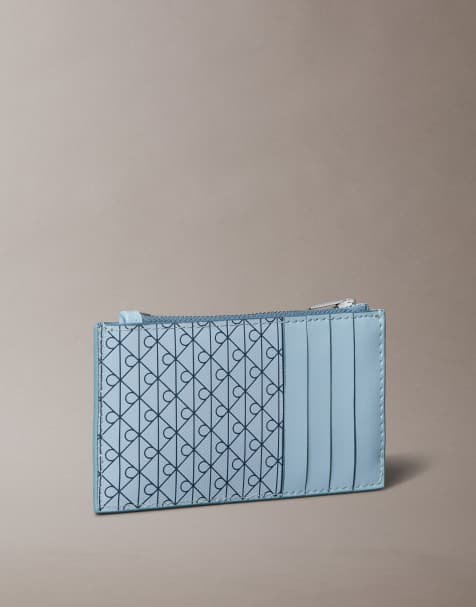 Calvin Klein Jeans emblem monogram logo zip purse in light blue - view 1