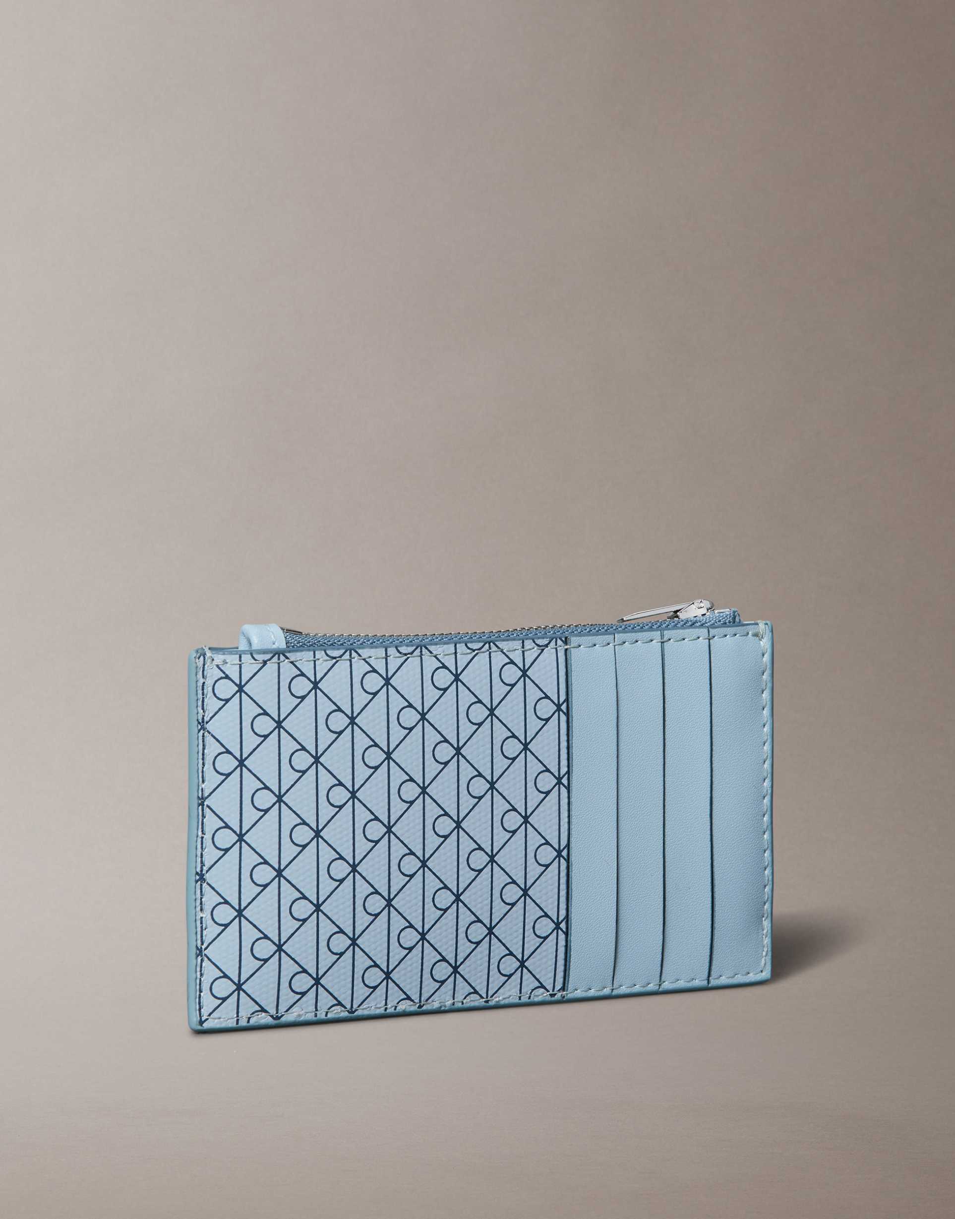 calvin klein jeans emblem monogram logo zip purse in light blue