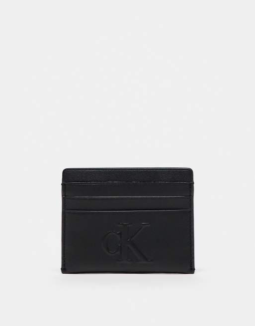 Calvin klein logo badge on the chest pocket embossed cardholder in black 