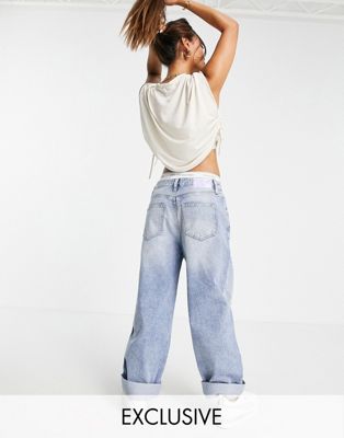 Calvin Klein Jeans Exclusive slouchy jean with turn up hem in mid wash - ASOS Price Checker