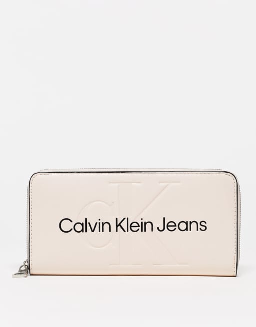 Calvin Klein Jeans – Geldbörse in Hellrosa mit Rundum-Reißverschluss und geprägtem Logo 