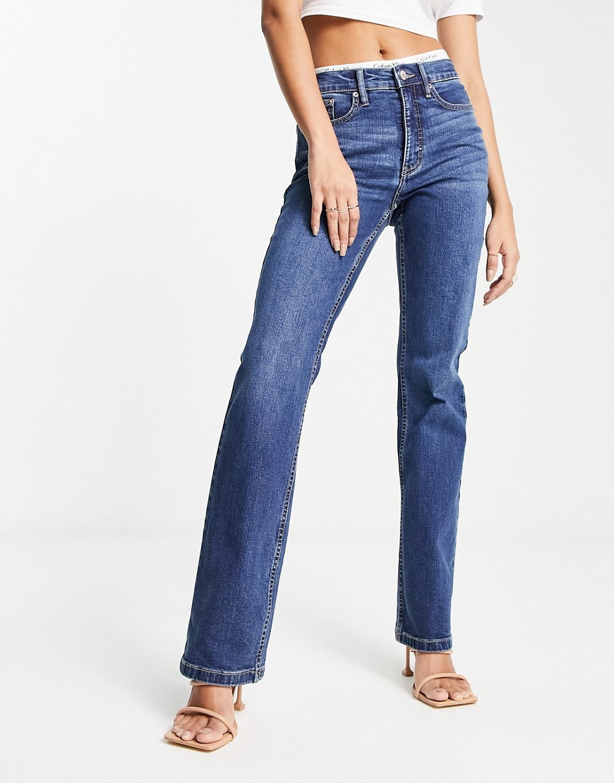 CALVIN KLEIN JEANS EST.1978 HIGH RISE BOOTCUT JEANS IN MID WASH-BLUE