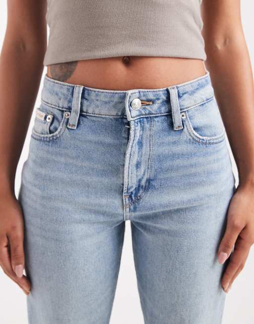 Calvin Klein Jeans high rise straight jeans with rip details in light wash blue, 4 of 5