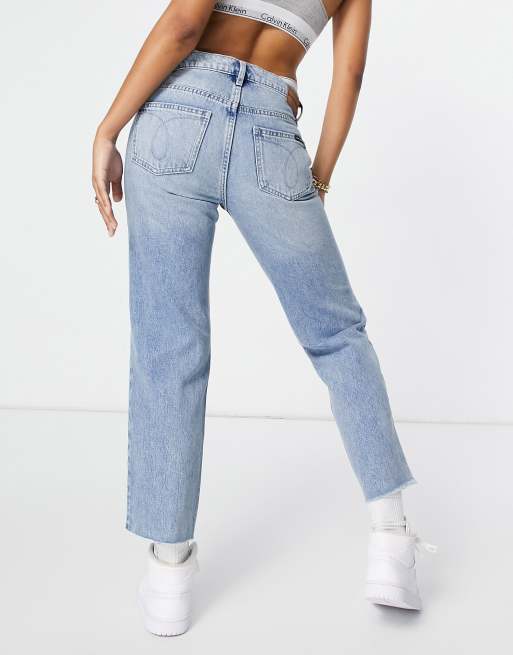 Calvin Klein Jeans high rise straight with rips in mid wash