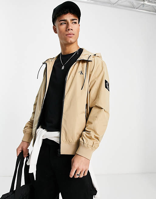 Calvin Klein Jeans hooded harrington jacket in tan | ASOS