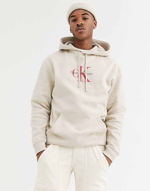 Calvin Klein Jeans Khakis capsule chest logo hoodie relaxed fit in beige |  ASOS
