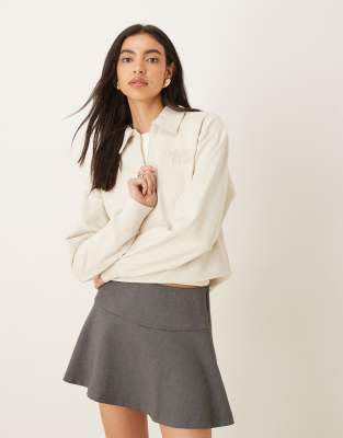 Calvin Klein Jeans - Langärmliges Polo-Oberteil in Ecru mit 1/4-Reißverschluss und Logo-Weiß