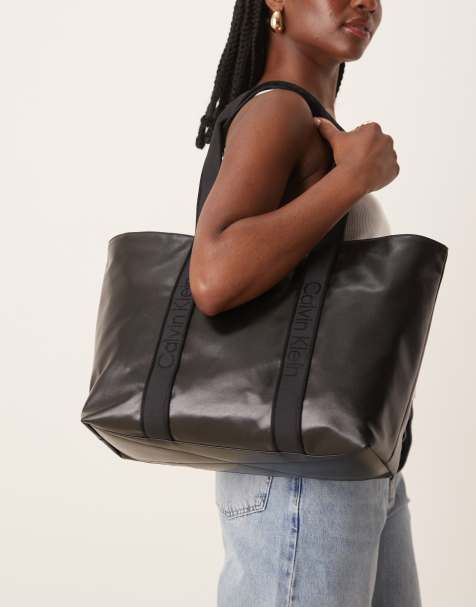 Calvin Klein Jeans large high shine tote bag in black - view 1