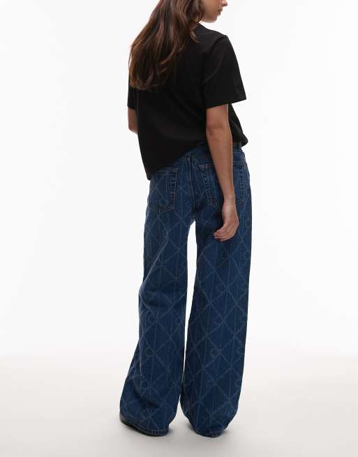 Calvin Klein Jeans laser cut repeat logo low rise baggy jeans in mid blue, 3 of 5