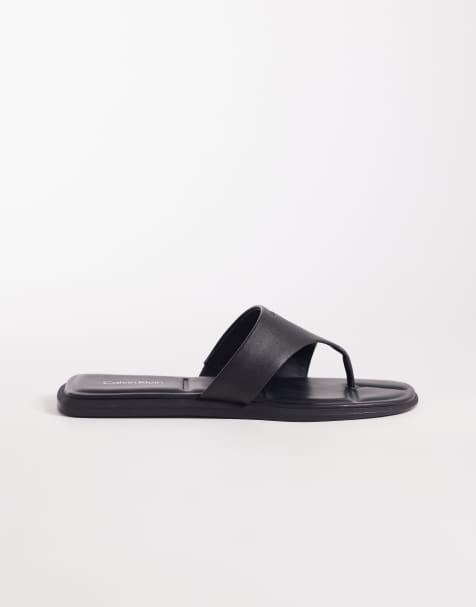 Calvin Klein Jeans leather flat thong sandals in black - view 1