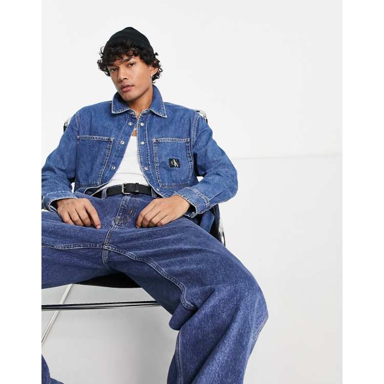 Calvin Klein Jeans linear logo relaxed fit denim shirt in mid wash