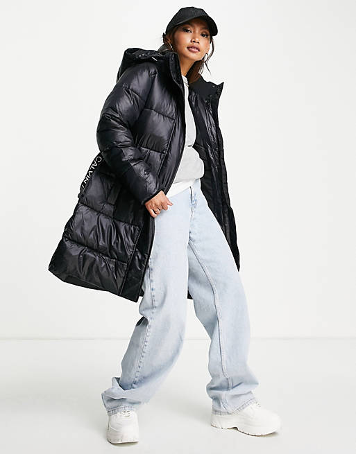 Calvin Klein Jeans logo belt long puffer jacket in black | ASOS