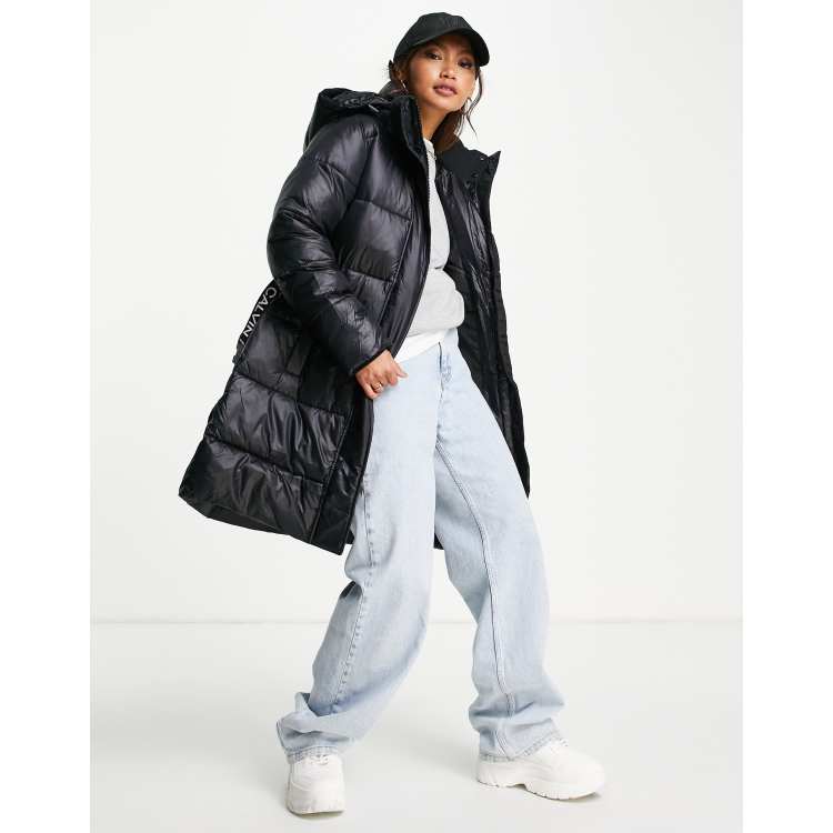 Calvin Klein Jeans logo belt long puffer jacket in black | ASOS