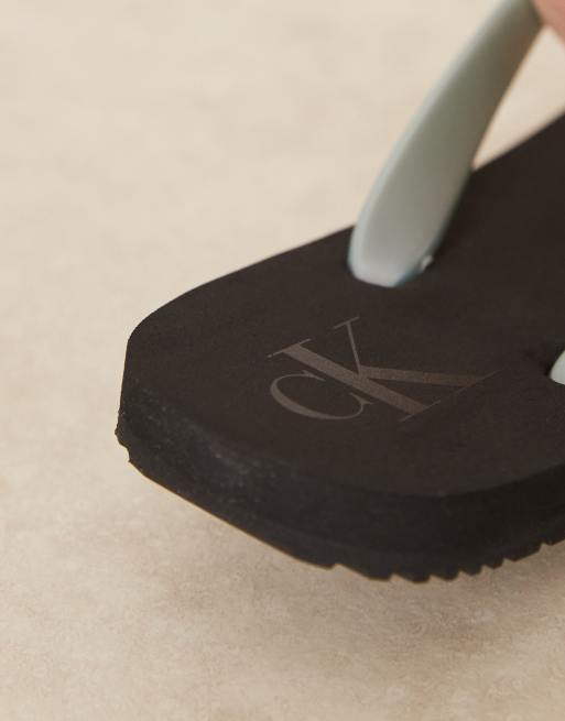 Calvin Klein Jeans logo flip flops in black and light blue, 3 of 4