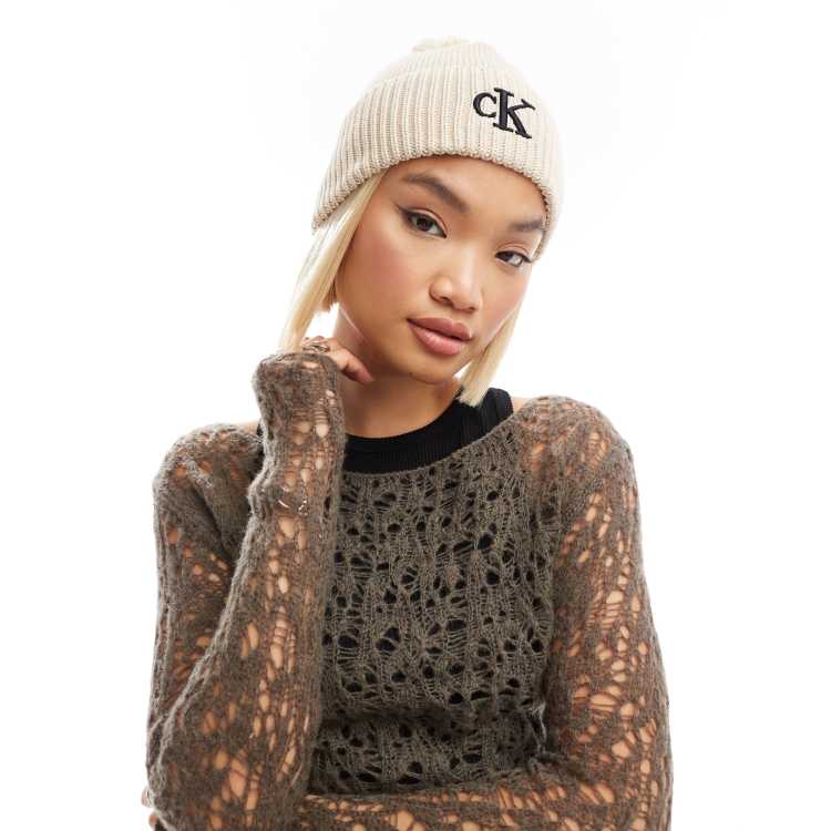 Calvin Klein Jeans logo pom pom beanie in cream ASOS