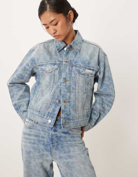 Calvin Klein Jeans logo print denim trucker jacket in lightwash blue 