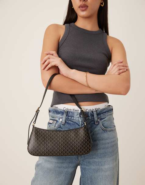 Calvin Klein Jeans logo print shoulder bag in black - view 1