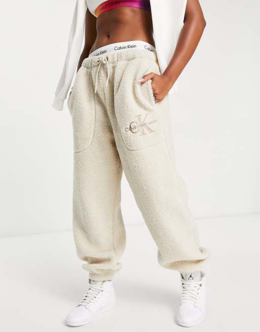 Calvin Klein Jeans logo sherpa joggers in eggshell | ASOS