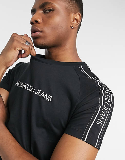 Calvin Klein Jeans logo tape shoulder t-shirt in black | ASOS