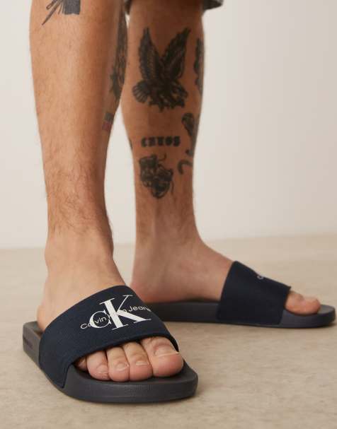 Calvin Klein Jeans – Marinblå tofflor med stor logga - view 1