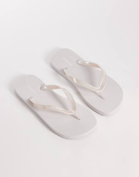 Calvin Klein Jeans metallic flip flops in silver - view 1