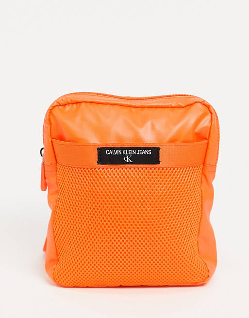 Calvin Klein Jeans mini reporter across body bag in orange