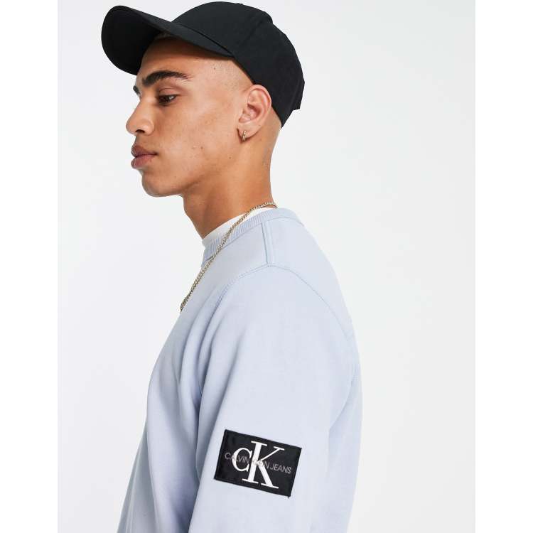 Calvin Klein Jeans monogram badge sweatshirt in light blue