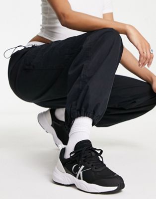 Calvin Klein Jeans monogram logo retro tennis trainers in black
