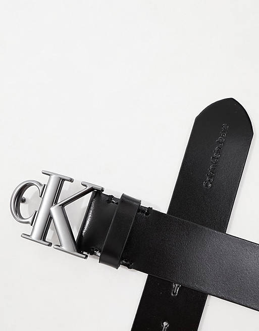Calvin Klein Jeans monogram logo round plaque leather belt in black | ASOS