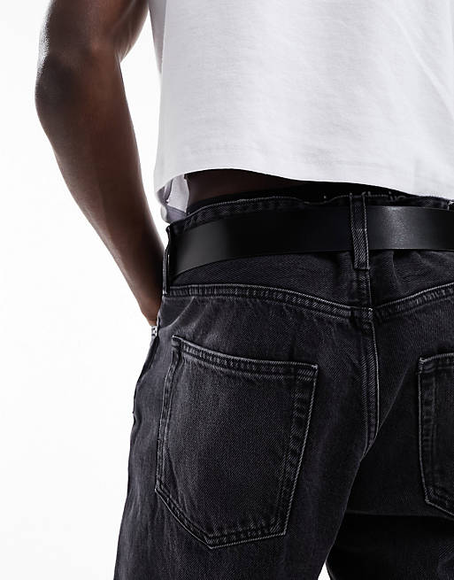 Calvin Klein Jeans monogram logo round plaque leather belt in black | ASOS