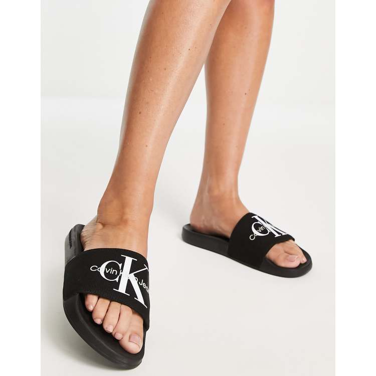 Calvin Klein Jeans monogram logo slider in black ASOS