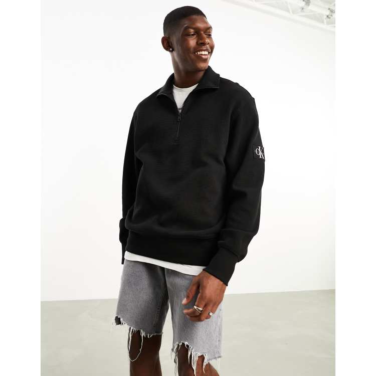 https://www.asos.com/calvin-klein-jeans/calvin-klein-jeans-monogram-logo-stencil-crew-neck-sweatshirt-in-brown/prd/205110049