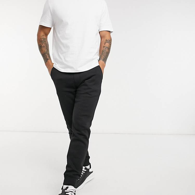 Calvin Klein Jeans monogram logo sweatpants in black | ASOS | Jogginghosen