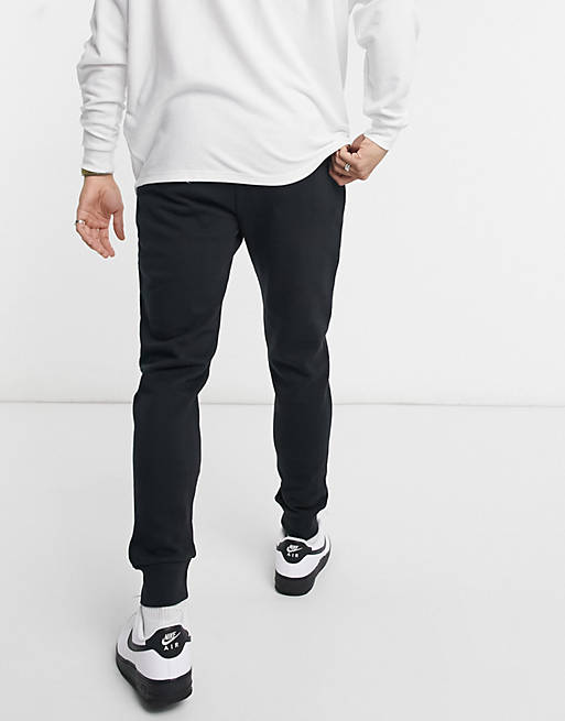 Calvin Klein Jeans monogram logo sweatpants in black | ASOS