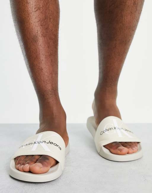 Calvin Klein Jeans monogram sliders in ivory ASOS