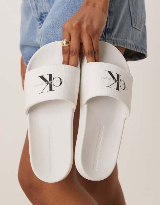 Calvin Klein Jeans monogram sliders in white and black ASOS