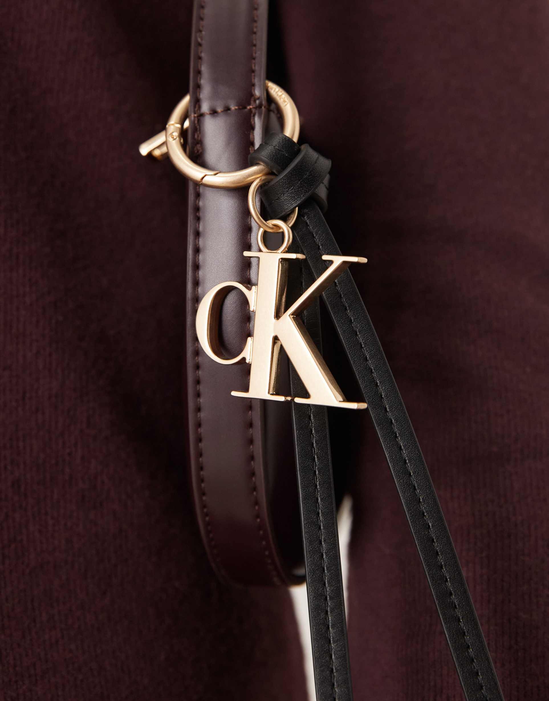 calvin klein jeans monogram tassel bag charm in black